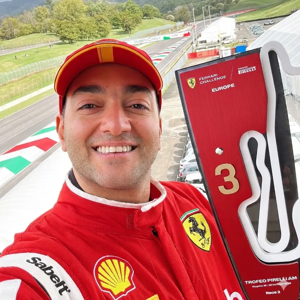 Mohamed Hamdy holding his third-place trophy at Mugello